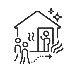 A person happily receiving guests at their front door, with a clean dog by their side.